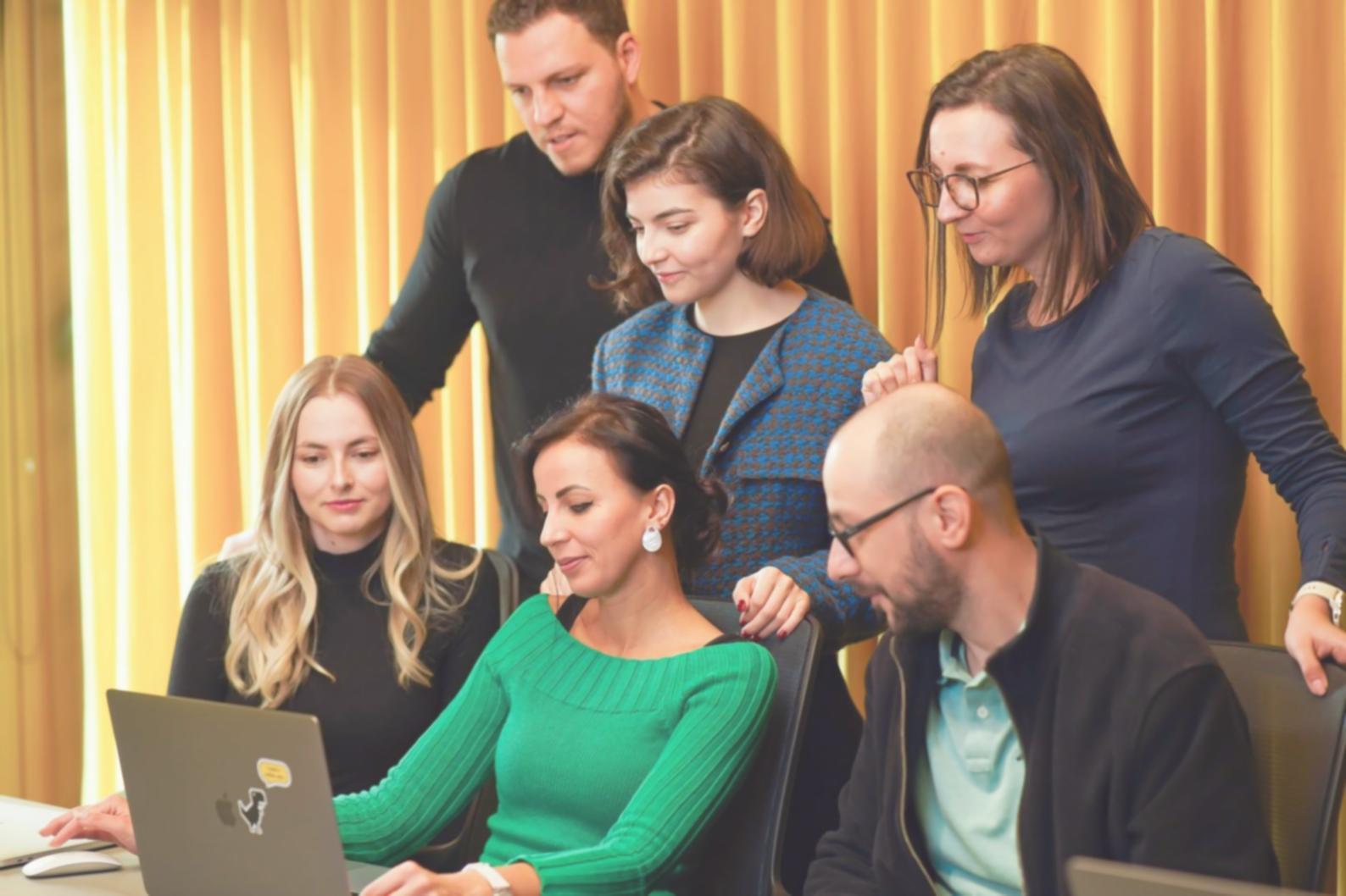 Business professionals analyzing financial data and market trends on computers